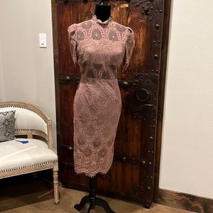 Rose colored dress with Lace covered cutouts.